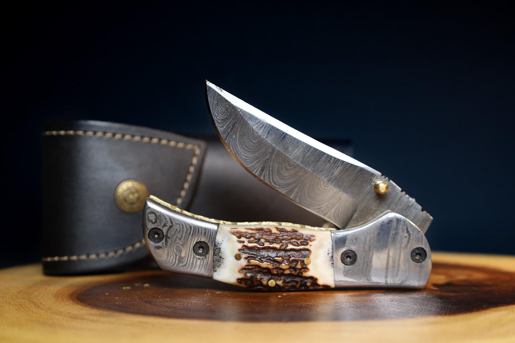 🦌 STAG HORNS IN THE WILD: Damascus Steel EDC Pocket Folding Knife With Leather Sheath by SacredBlade